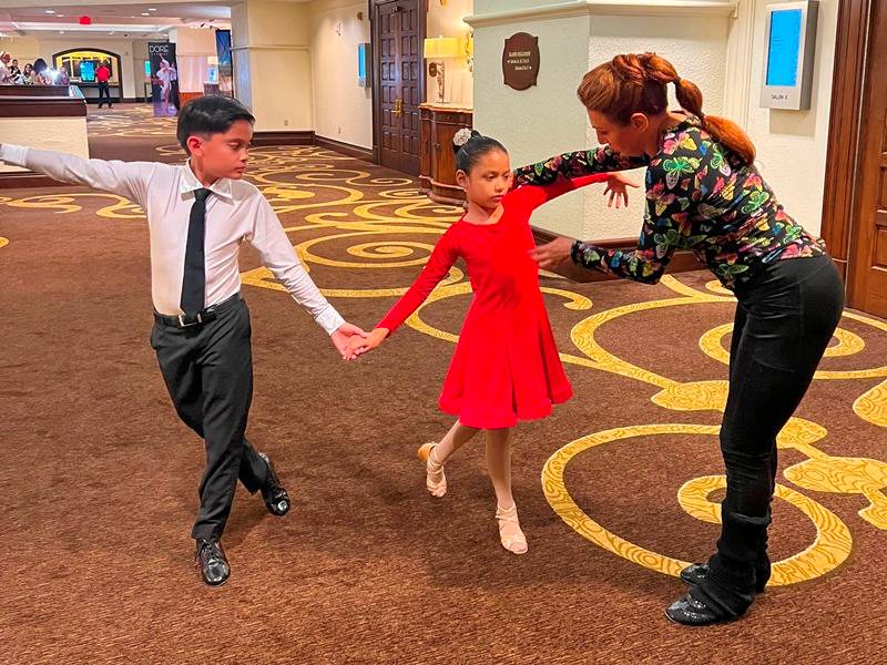 Denis and Jeanette coaching young dancers at San Antonio Classic